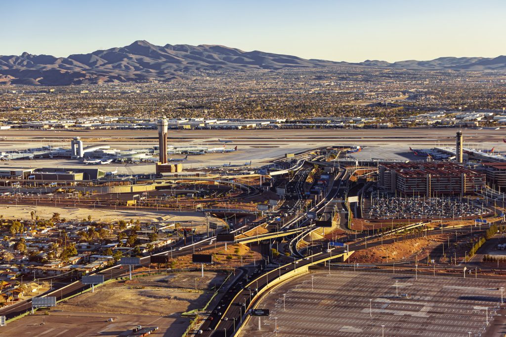 Aerial view of Las Vegas airport and surrounding Nevada landscape, showcasing popular Las Vegas helicopter tours and Vegas attractions.