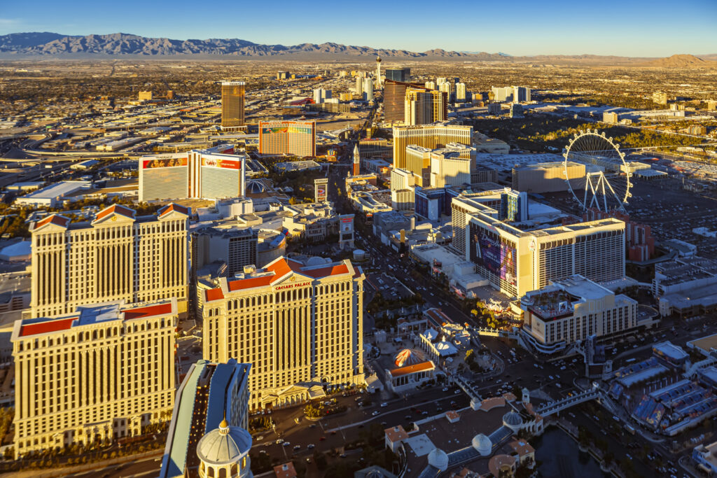 Aerial view of the Las Vegas Strip at sunset featuring casinos and landmarks, ideal for scenic helicopter tours over the Vegas Strip.